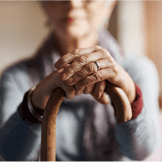 Aging women holding cane